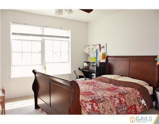 34 Inverness Drive Edison, NJ 08820 - Photo 14 of 16 a bedroom with a bed and window