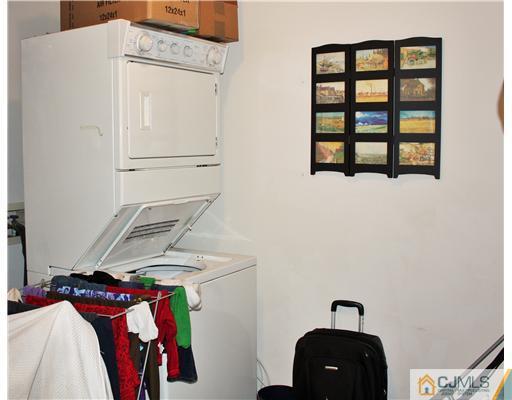 34 Inverness Drive Edison, NJ 08820 - Photo 16 of 16 a view of walk in closet with clothes and shoes
