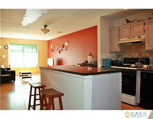 34 Inverness Drive Edison, NJ 08820 - Photo 4 of 16 a kitchen with stainless steel appliances granite countertop a sink and cabinets
