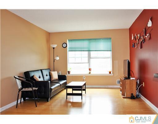 34 Inverness Drive Edison, NJ 08820 - Photo 6 of 16 a living room with furniture and a window