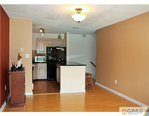 34 Inverness Drive Edison, NJ 08820 - Photo 7 of 16 a kitchen with a refrigerator and a stove