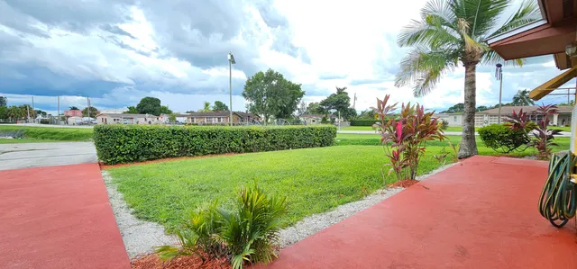 a view of a garden and a houses