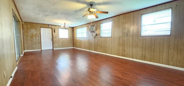 a view of livingroom with hardwood floor and ceiling fan