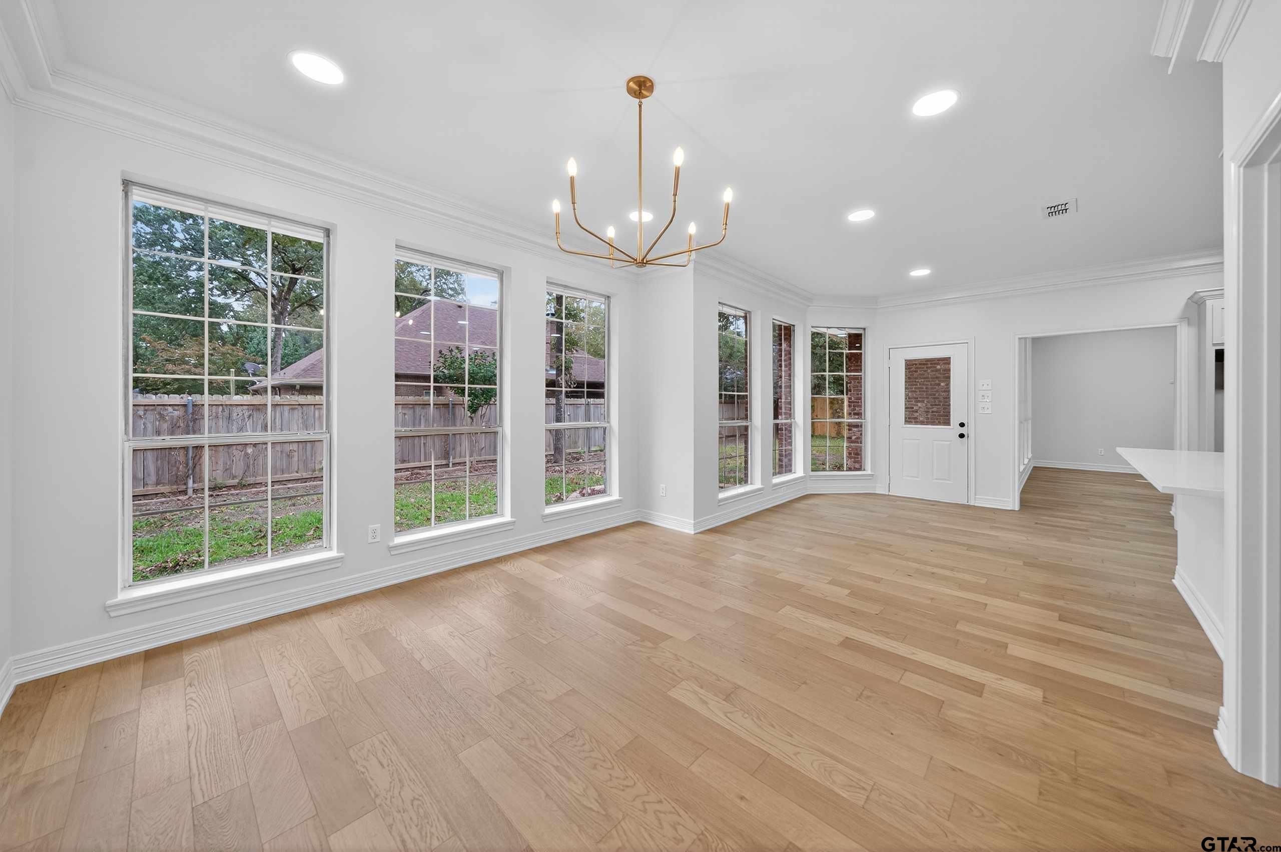 3409 Pebblebrook Drive Tyler, TX 75707 - Photo 17 of 48 a view of an empty room with glass door and balcony