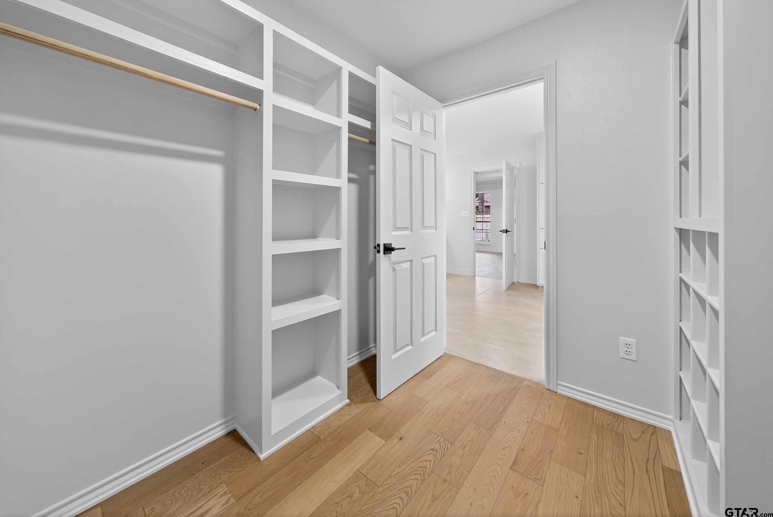 3409 Pebblebrook Drive Tyler, TX 75707 - Photo 25 of 48 a view of an empty room with wooden floor and closet