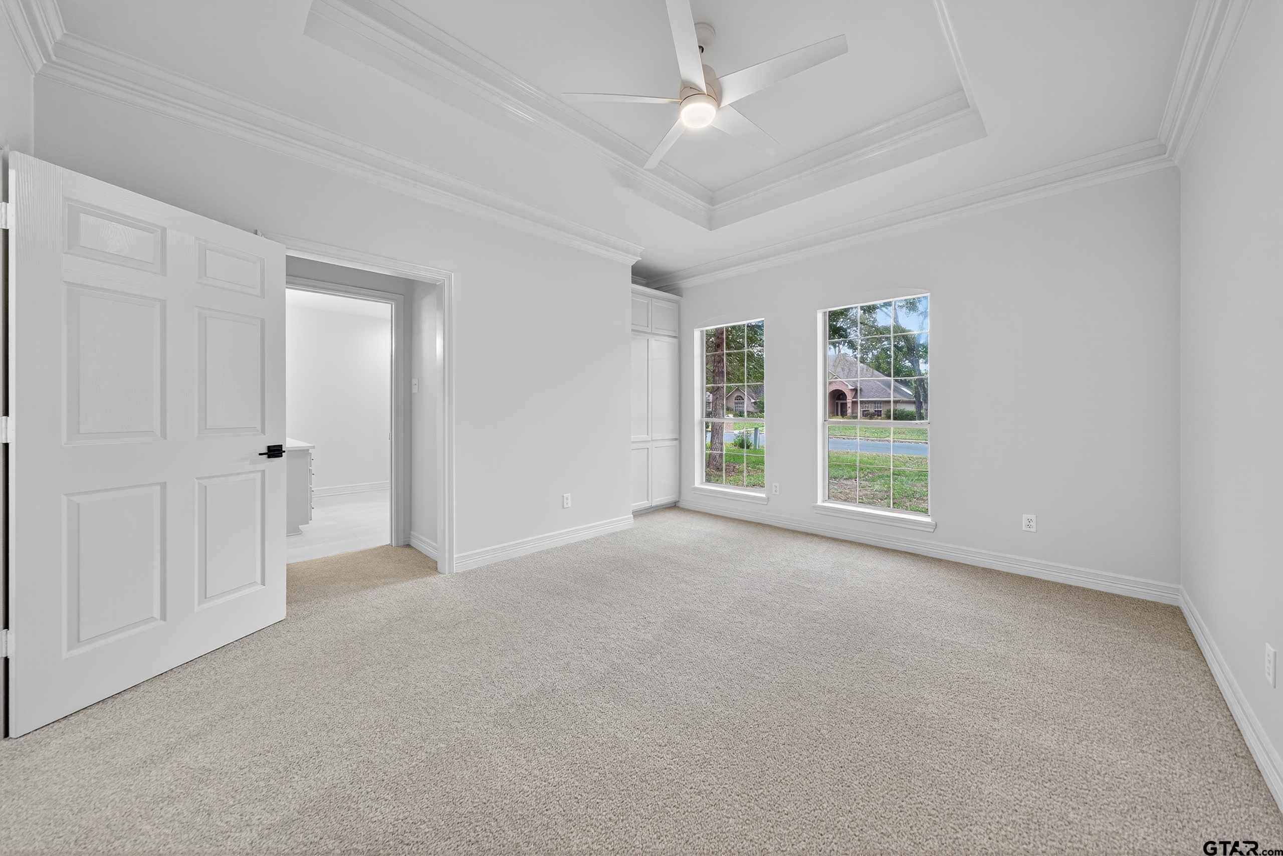 3409 Pebblebrook Drive Tyler, TX 75707 - Photo 26 of 48 an empty room with windows and closet area