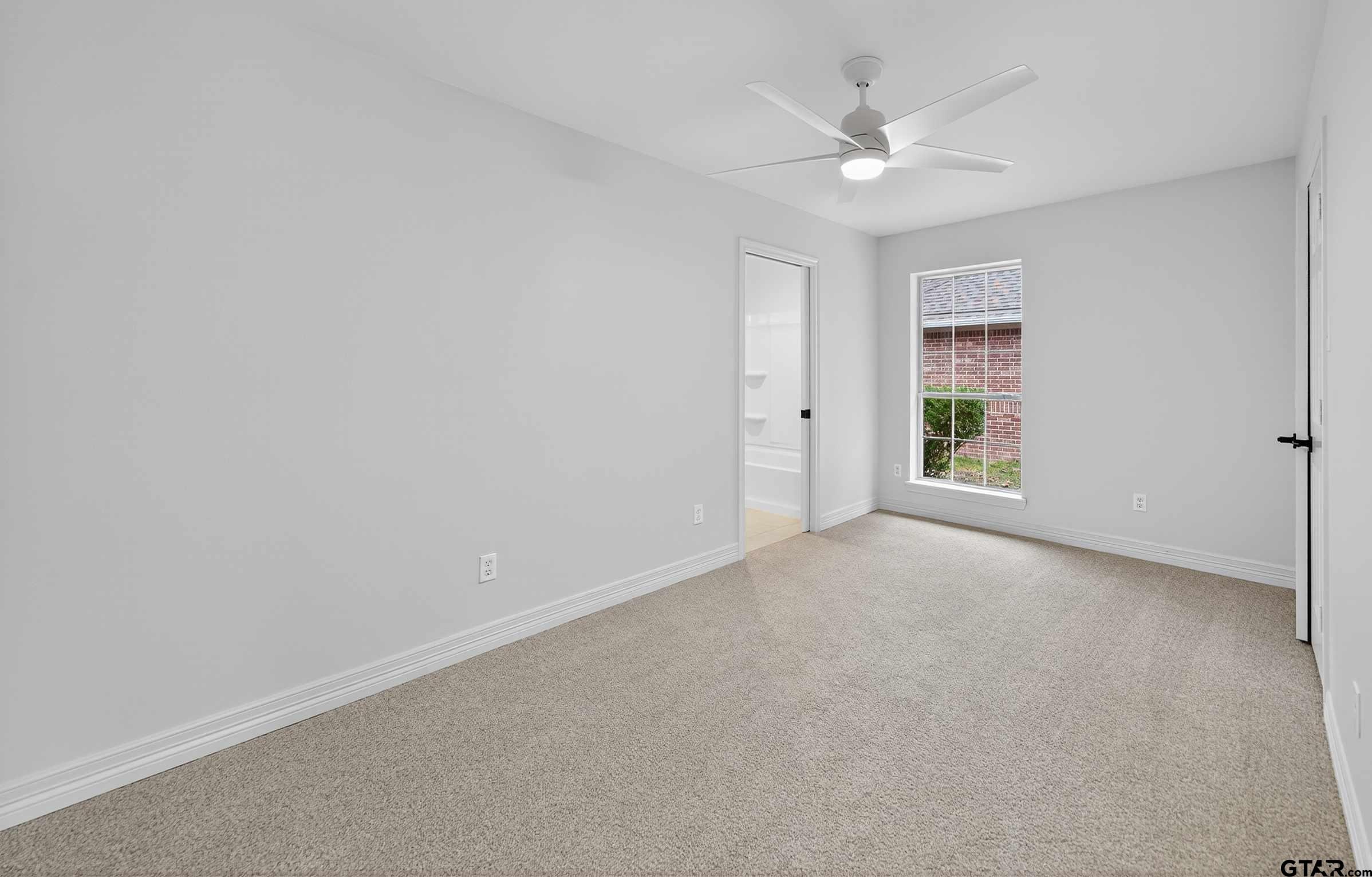 3409 Pebblebrook Drive Tyler, TX 75707 - Photo 34 of 48 an empty room with closet and ceiling fan