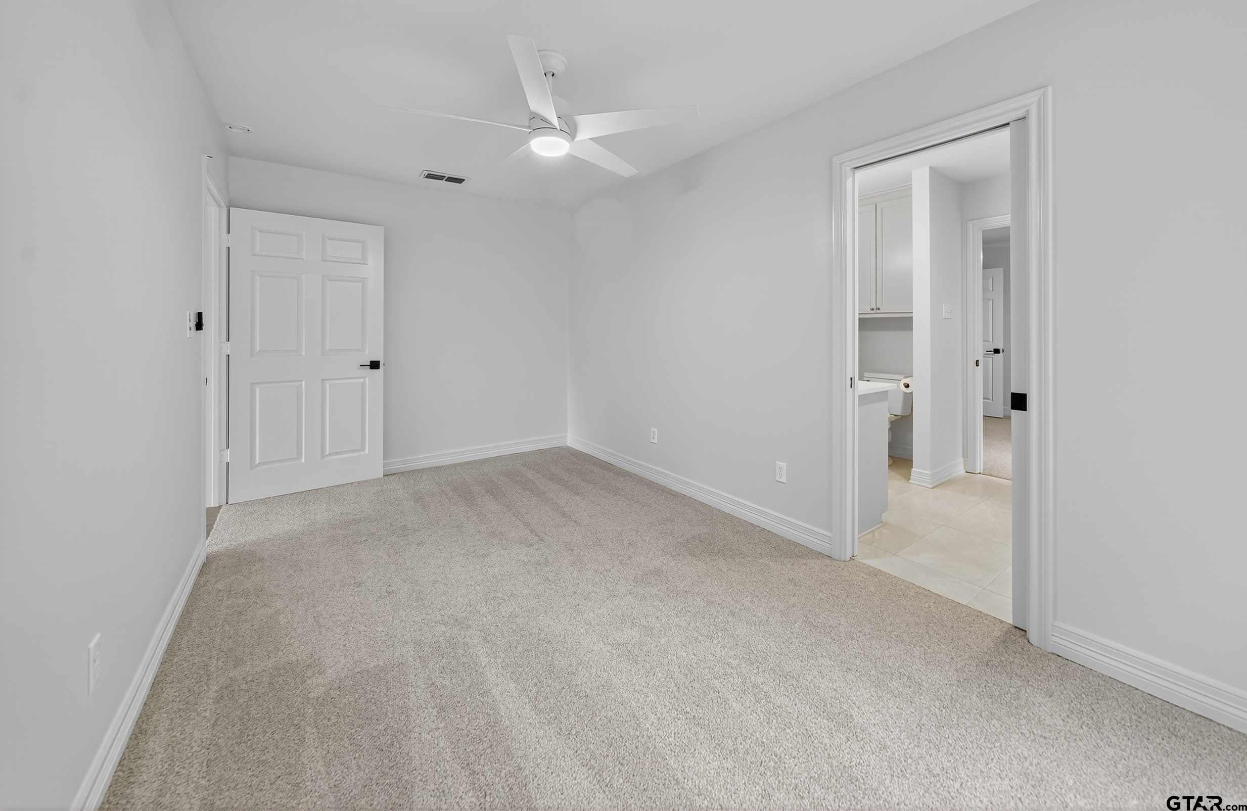 3409 Pebblebrook Drive Tyler, TX 75707 - Photo 35 of 48 a view of an empty room with a window