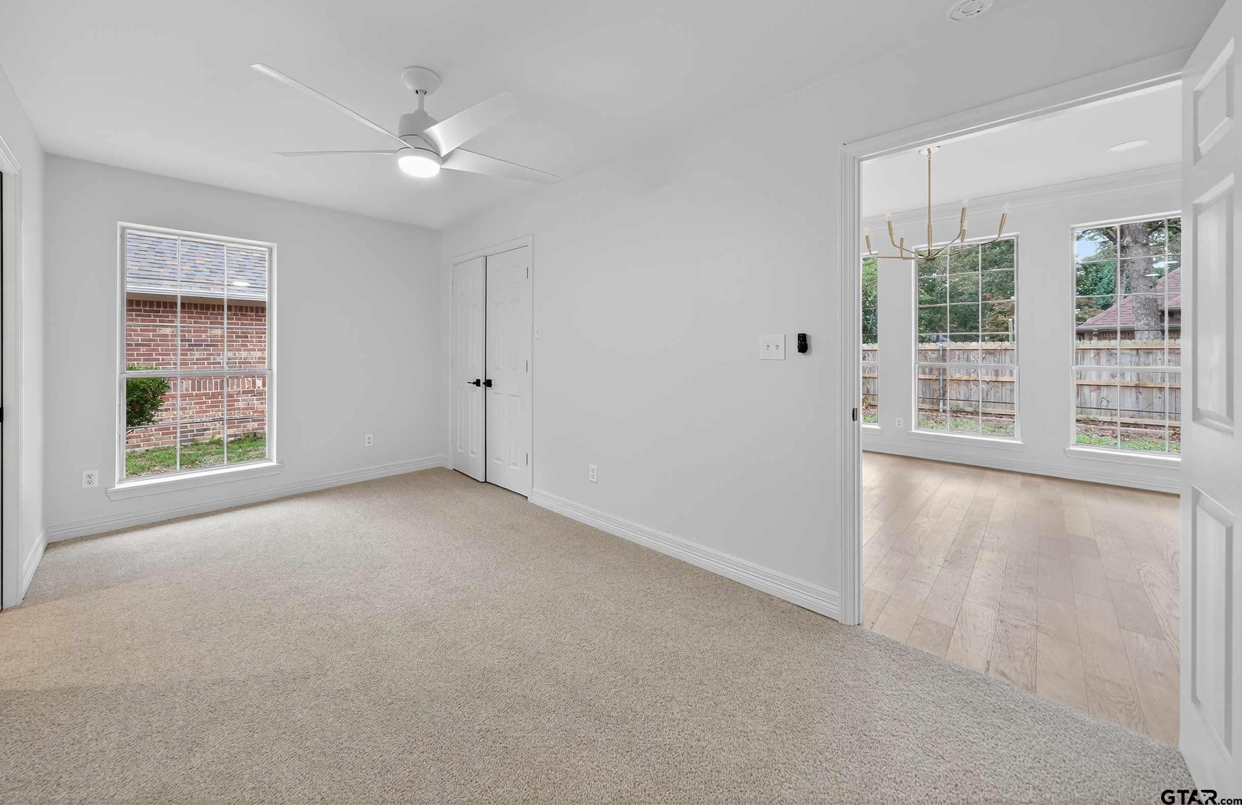 3409 Pebblebrook Drive Tyler, TX 75707 - Photo 36 of 48 a view of a livingroom with a ceiling fan and window