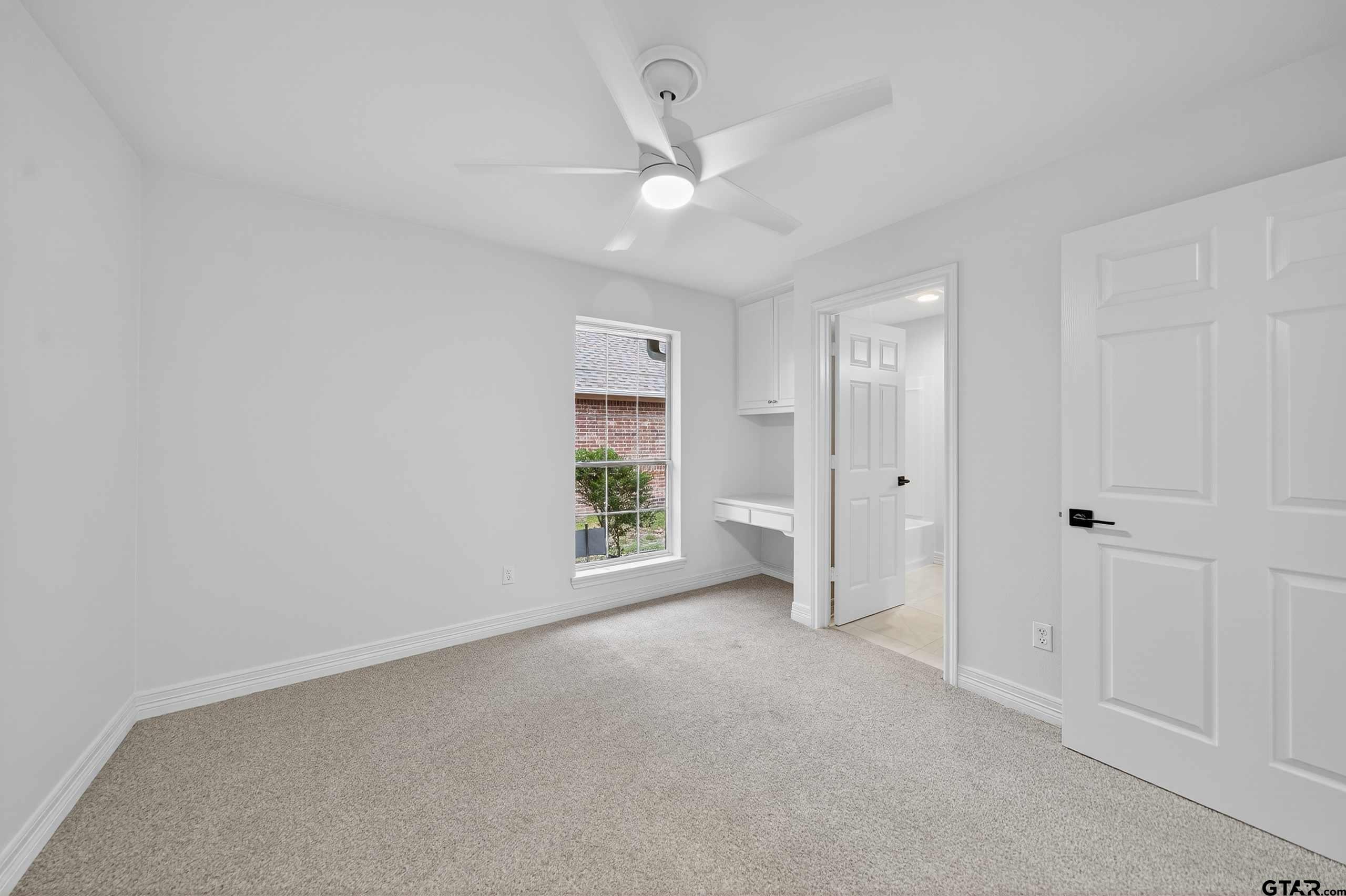 3409 Pebblebrook Drive Tyler, TX 75707 - Photo 43 of 48 a view of an empty room with a window