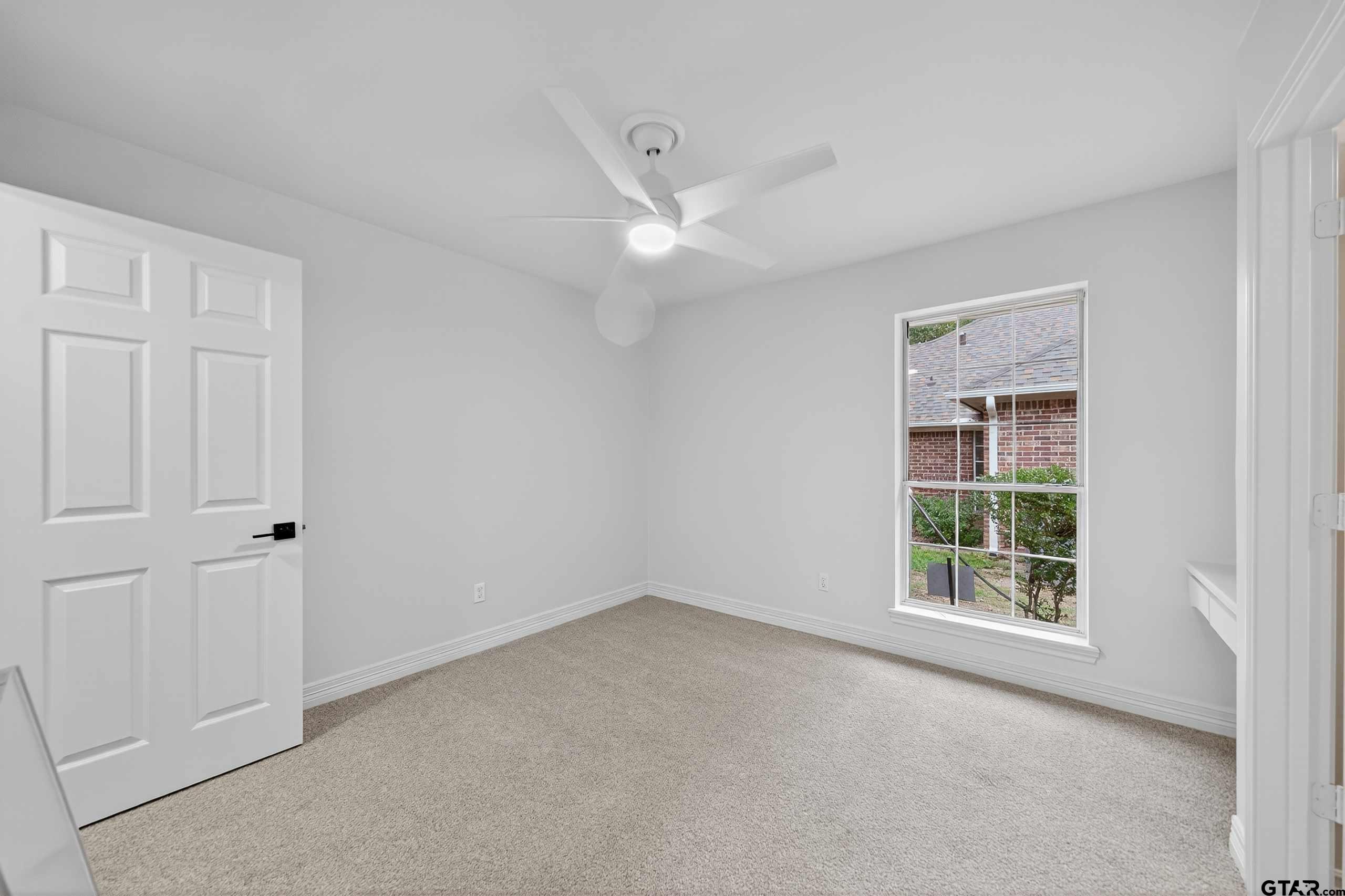 3409 Pebblebrook Drive Tyler, TX 75707 - Photo 44 of 48 a view of an empty room with a window