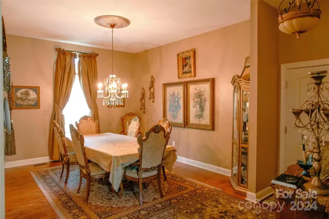 a kitchen with stainless steel appliances granite countertop a refrigerator a sink and a stove