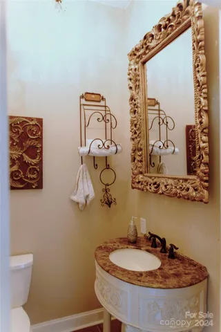 a view of a livingroom with furniture and a flat screen tv