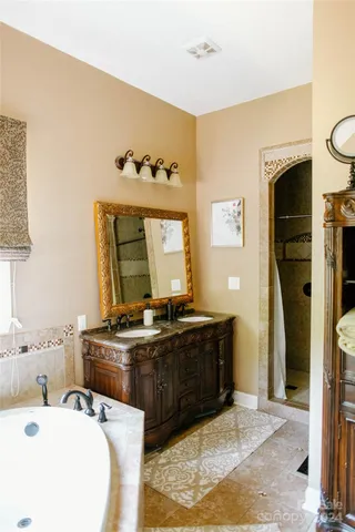 a bathroom with a bathtub and a window