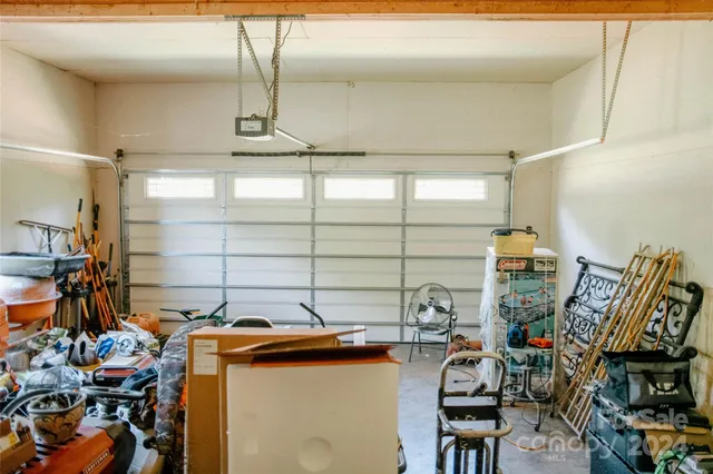 a front view of a house with swimming pool and porch with furniture