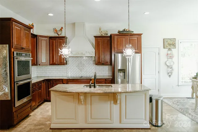 a kitchen with a stove and cabinets