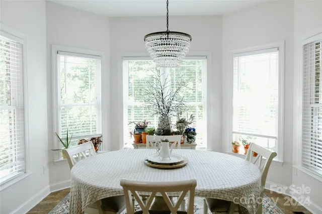 a kitchen with a table chairs and entryway