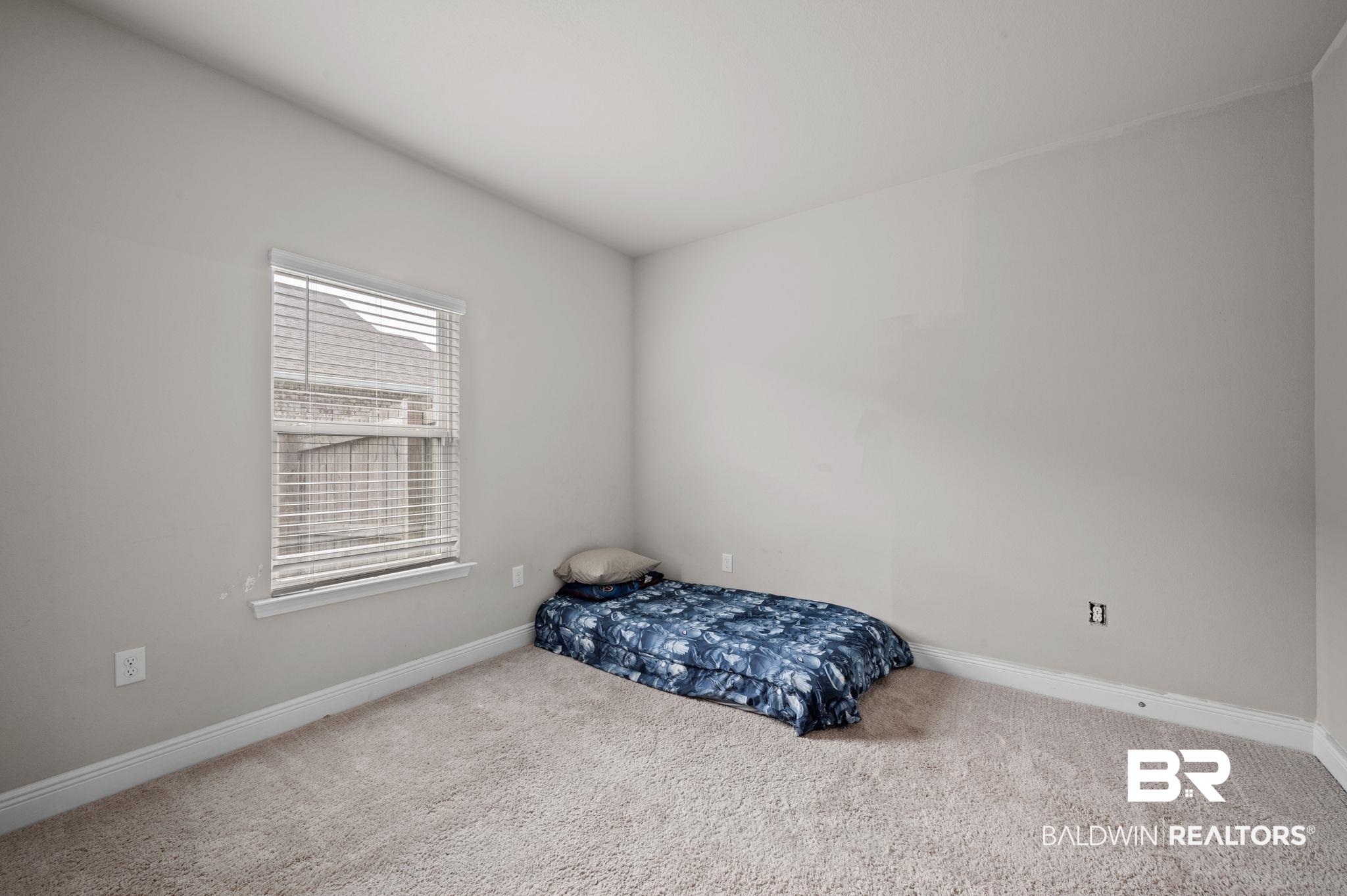 10169 Dunleith Loop Daphne, AL 36526 - Photo 37 of 40 Bedroom with carpet floors and baseboards