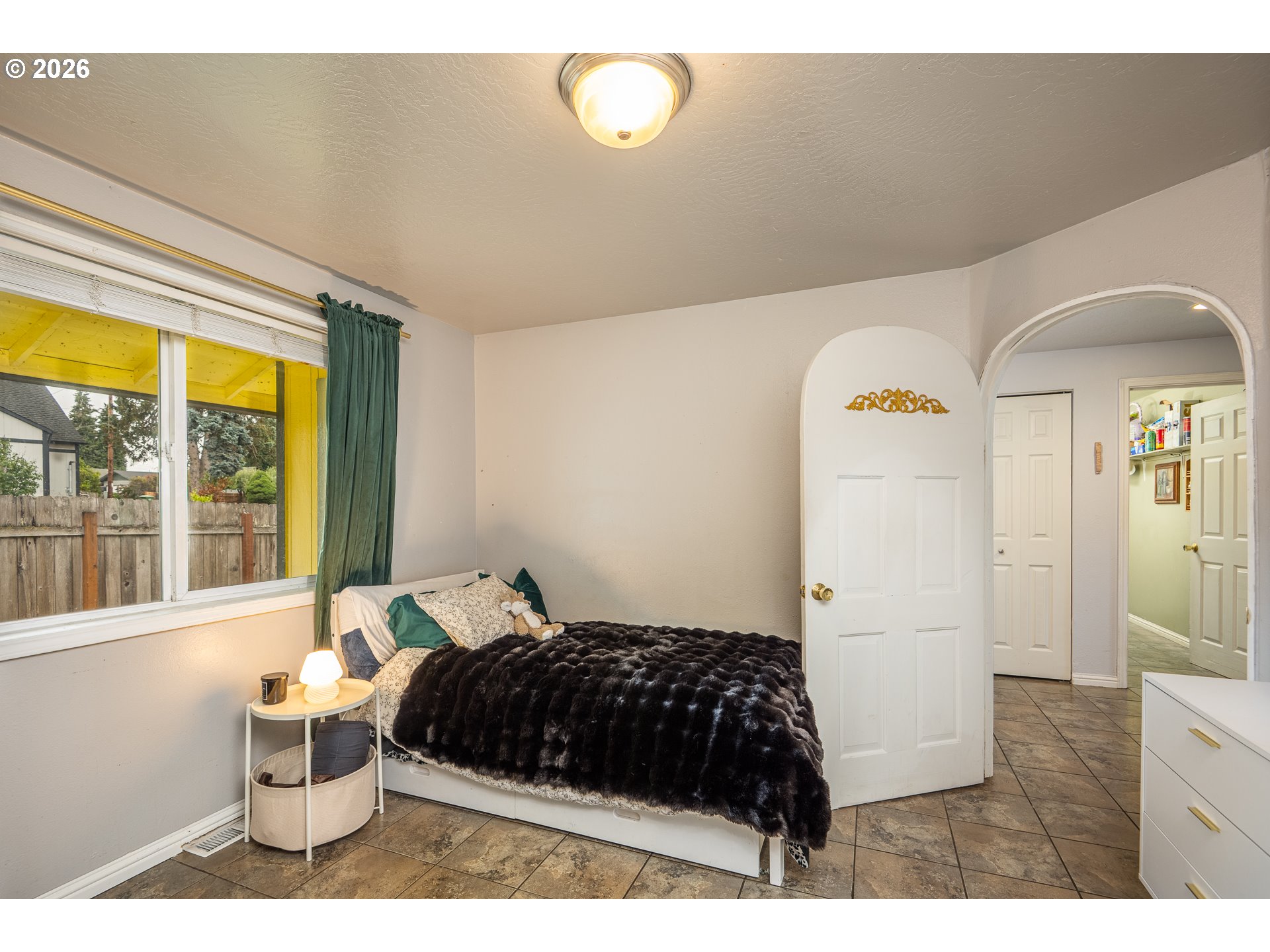 90 South 17th Street Cottage Grove, OR 97424 - Photo 12 of 23 a bedroom with a bed and a window