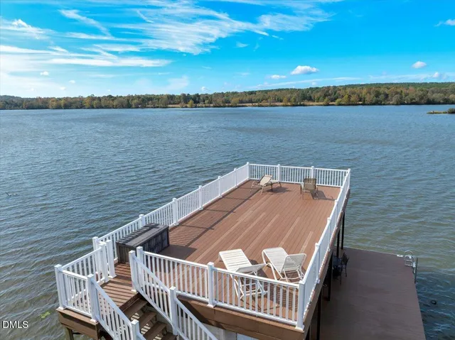 a view of a chairs and table in backyard of the house
