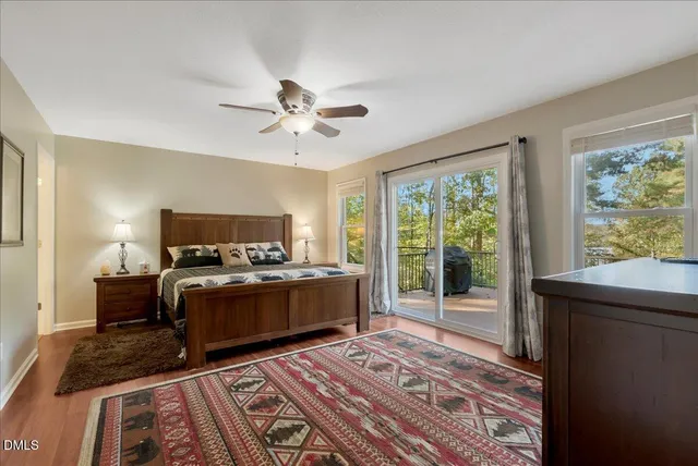 an aerial view of a houses with a lake view