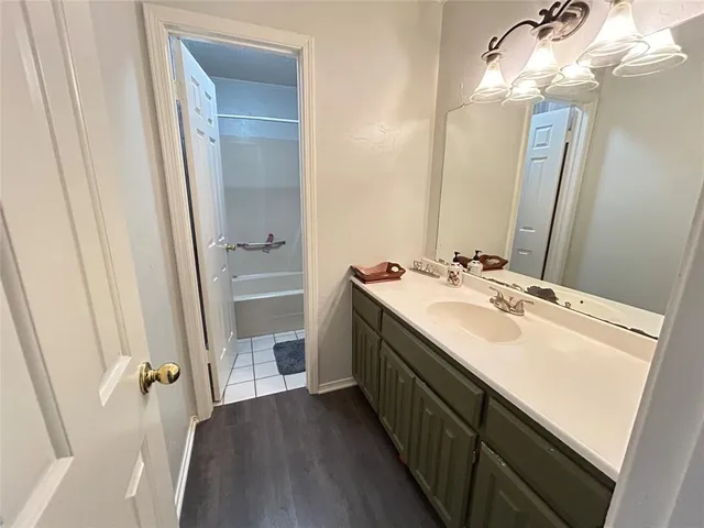 a bathroom with a sink a vanity and a mirror