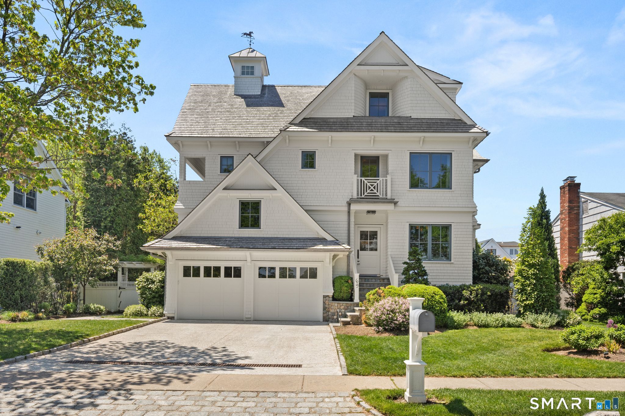 69 Birch Road Fairfield, CT 06824 - Photo 1 of 40 a front view of a house with garden