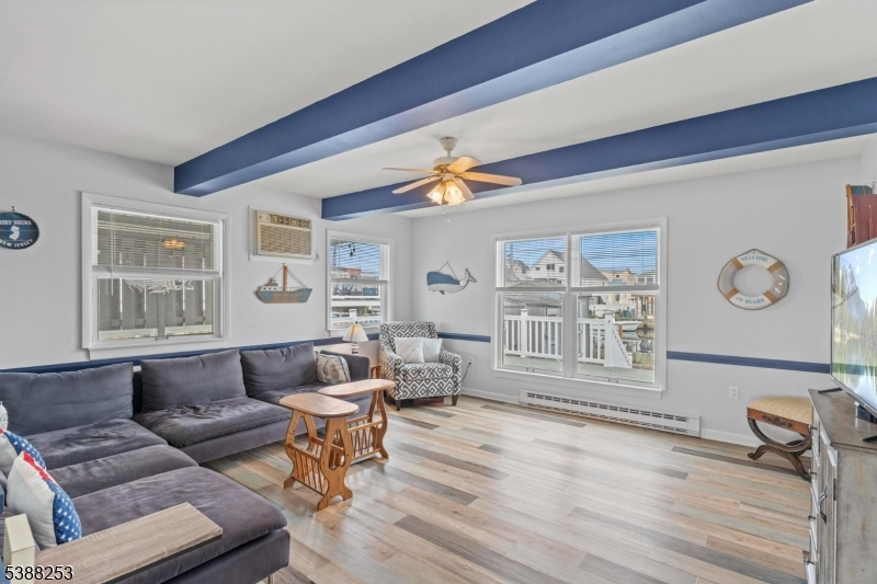 112 Curlew Road Tuckerton, NJ 08087 - Photo 2 of 20 a living room with furniture and wooden floor