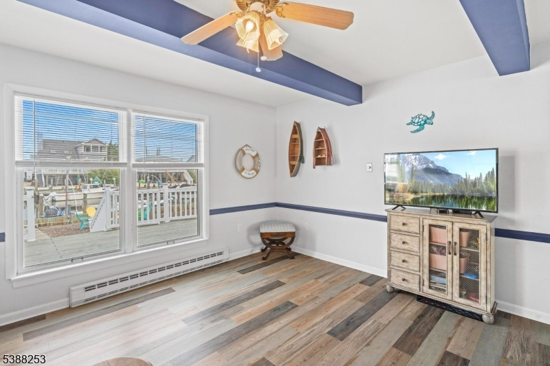 112 Curlew Road Tuckerton, NJ 08087 - Photo 5 of 20 a living room with furniture and a flat screen tv