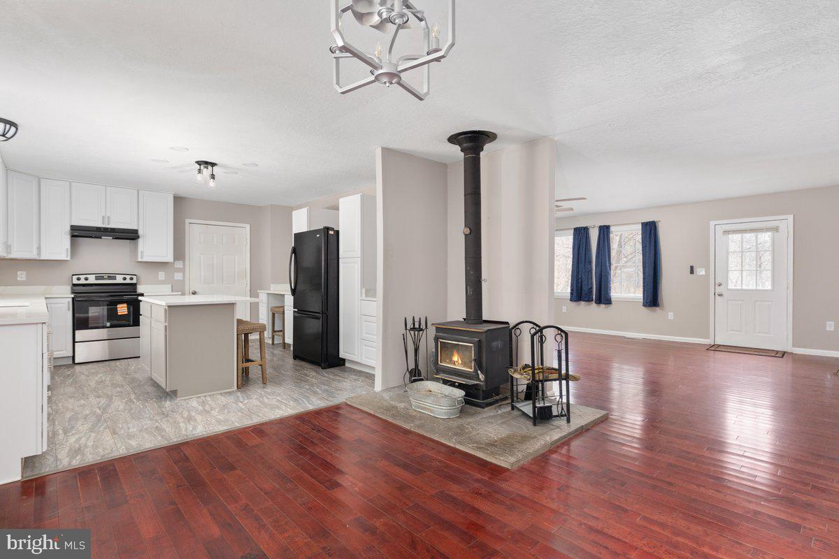 503 Pomeroy Road Front Royal, VA 22630 - Photo 8 of 41 Wood Burning Stove Between Dining, Kitchen and LR