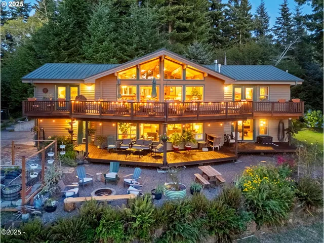 an aerial view of a house with swimming pool yard and outdoor seating
