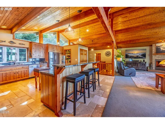 a view of a patio with dining table and chairs with wooden floor