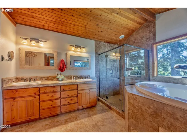 a spacious bathroom with a granite countertop sink and a large mirror