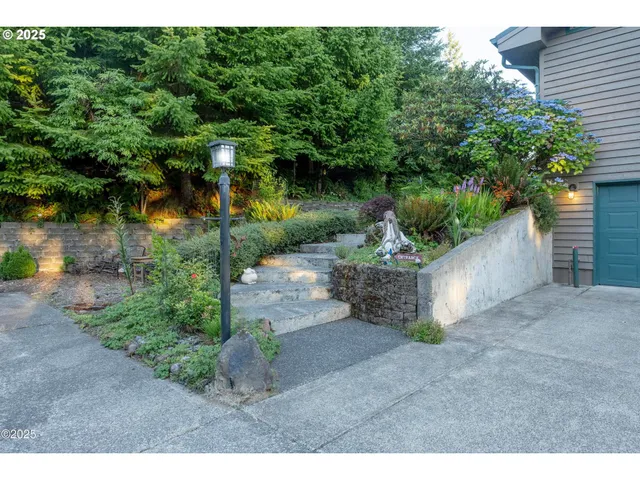 a backyard of a house with a yard and outdoor seating