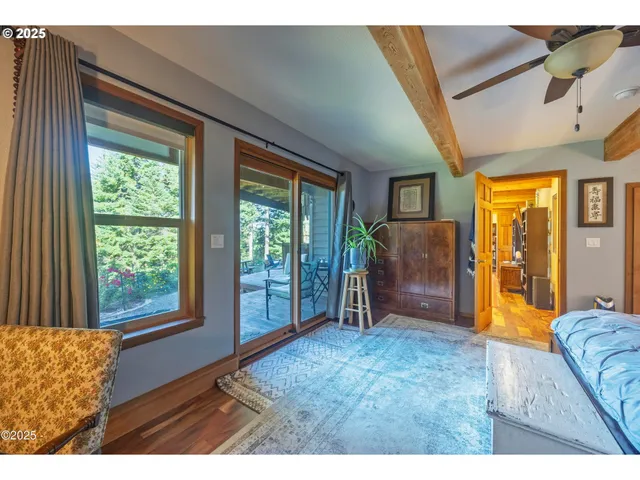 a living room with furniture and a floor to ceiling window
