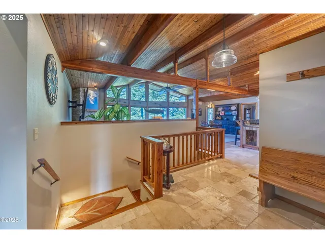 a view of entryway livingroom and hall with wooden floor