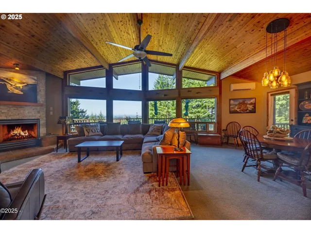 a outdoor living space with furniture and a fireplace