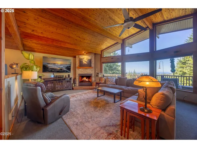 a living room with furniture a rug and a large window