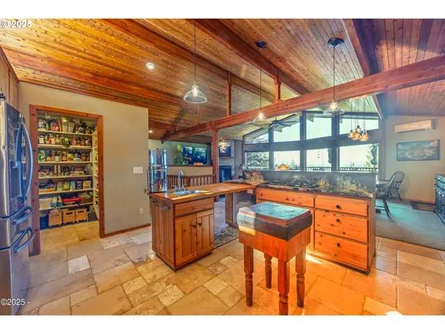 a kitchen with stainless steel appliances granite countertop a stove and cabinets
