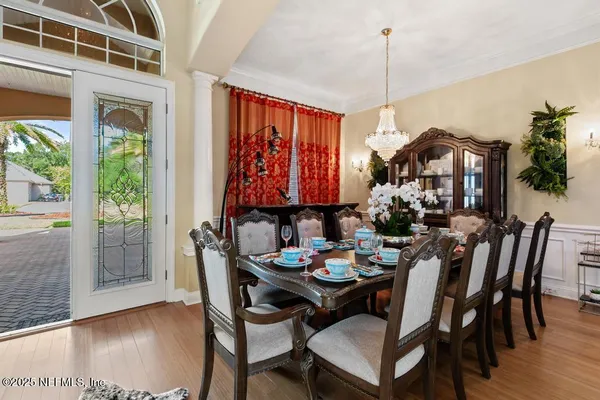 a living room with furniture a fireplace and next to a window