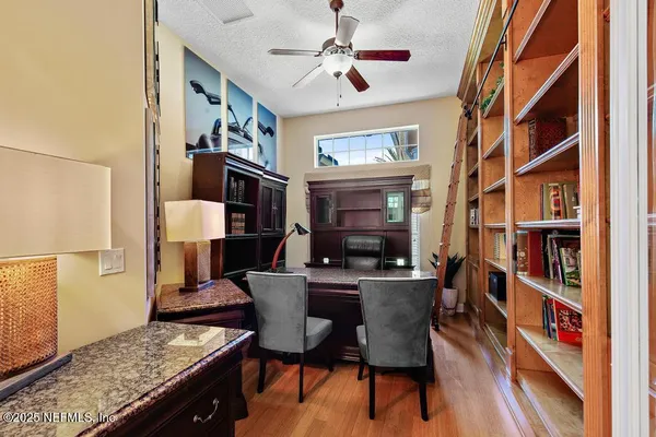 a view of living room with furniture and a fireplace