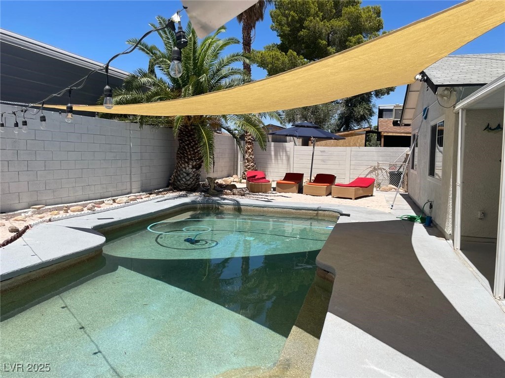 5415 Oxbow Street Las Vegas, NV 89119 - Photo 17 of 20 View of pool featuring a patio area and a fenced backyard