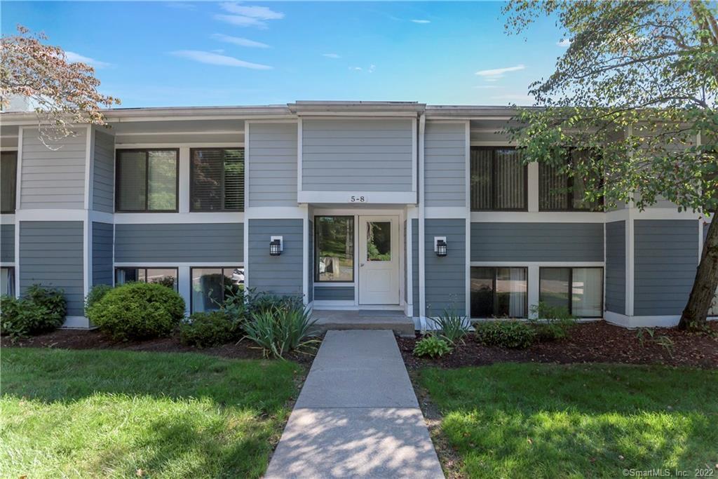 5 Carpenter Close, Unit 5 Ridgefield, CT 06877 - Photo 1 of 1 a front view of a house with garden