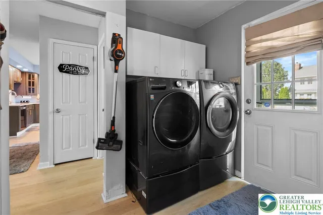 a view of a storage & utility room with a window