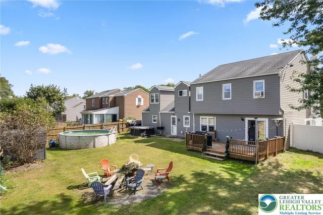 a view of a house with swimming pool and porch