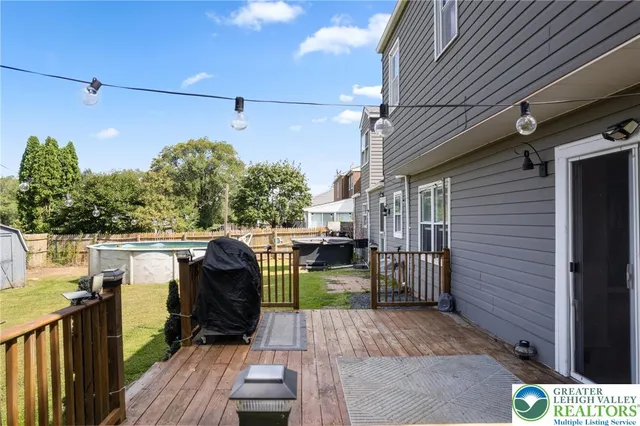 a view of a deck with wooden floor and seating space
