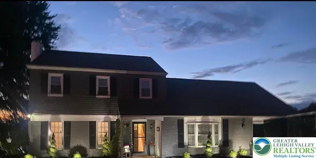 a front view of a house with yard