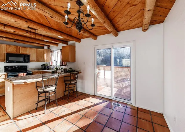 a view of an empty room with closet and a window
