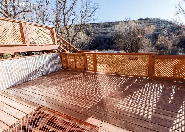 a view of water heater and covered with wooden fence