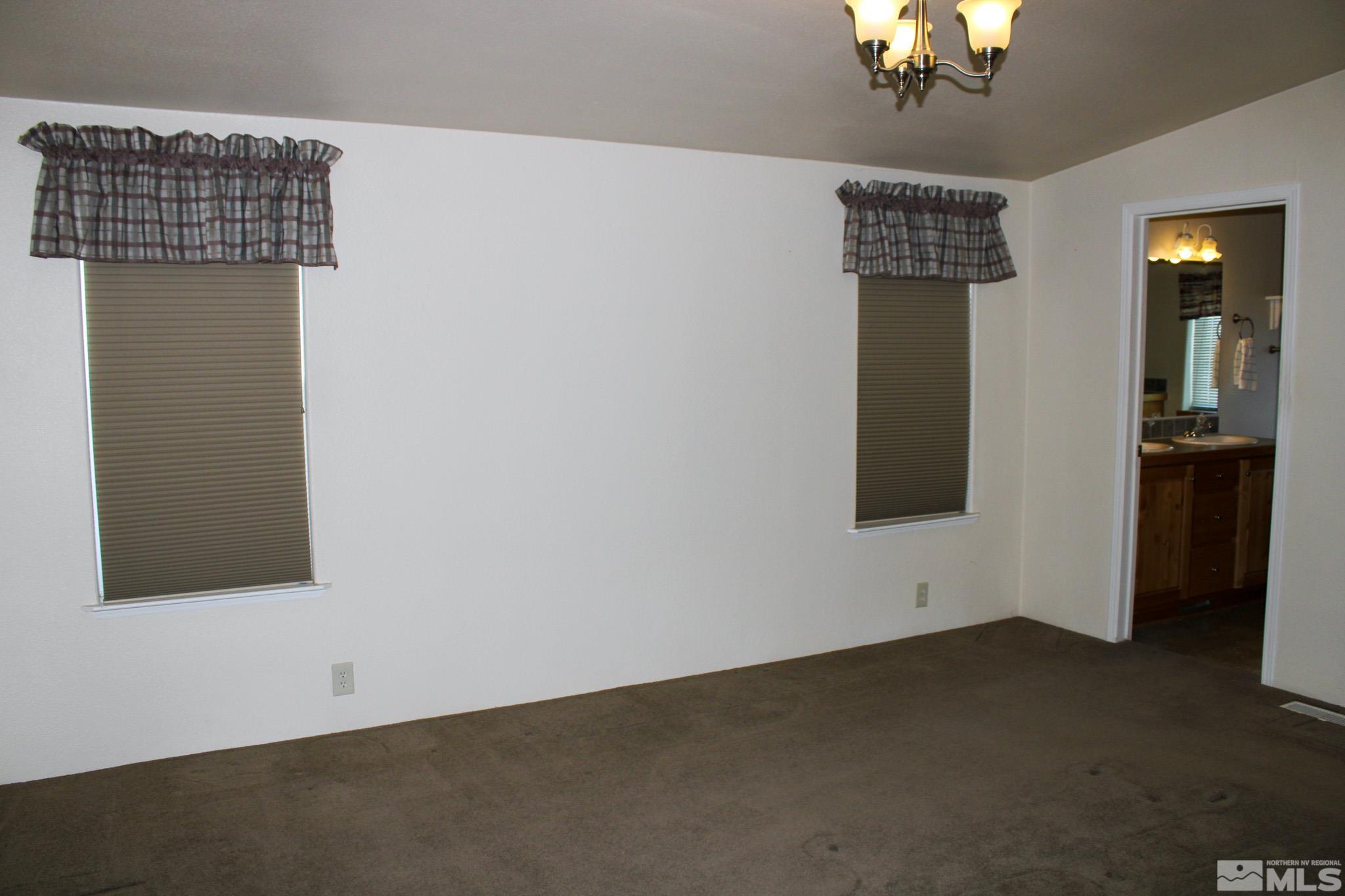 1850 Pam's Place Fallon, NV 89406 - Photo 16 of 40 a view of an empty room with a window